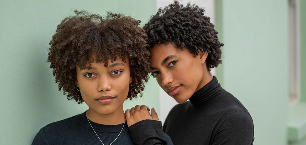 Two women posing, Moisturizing 4C hair