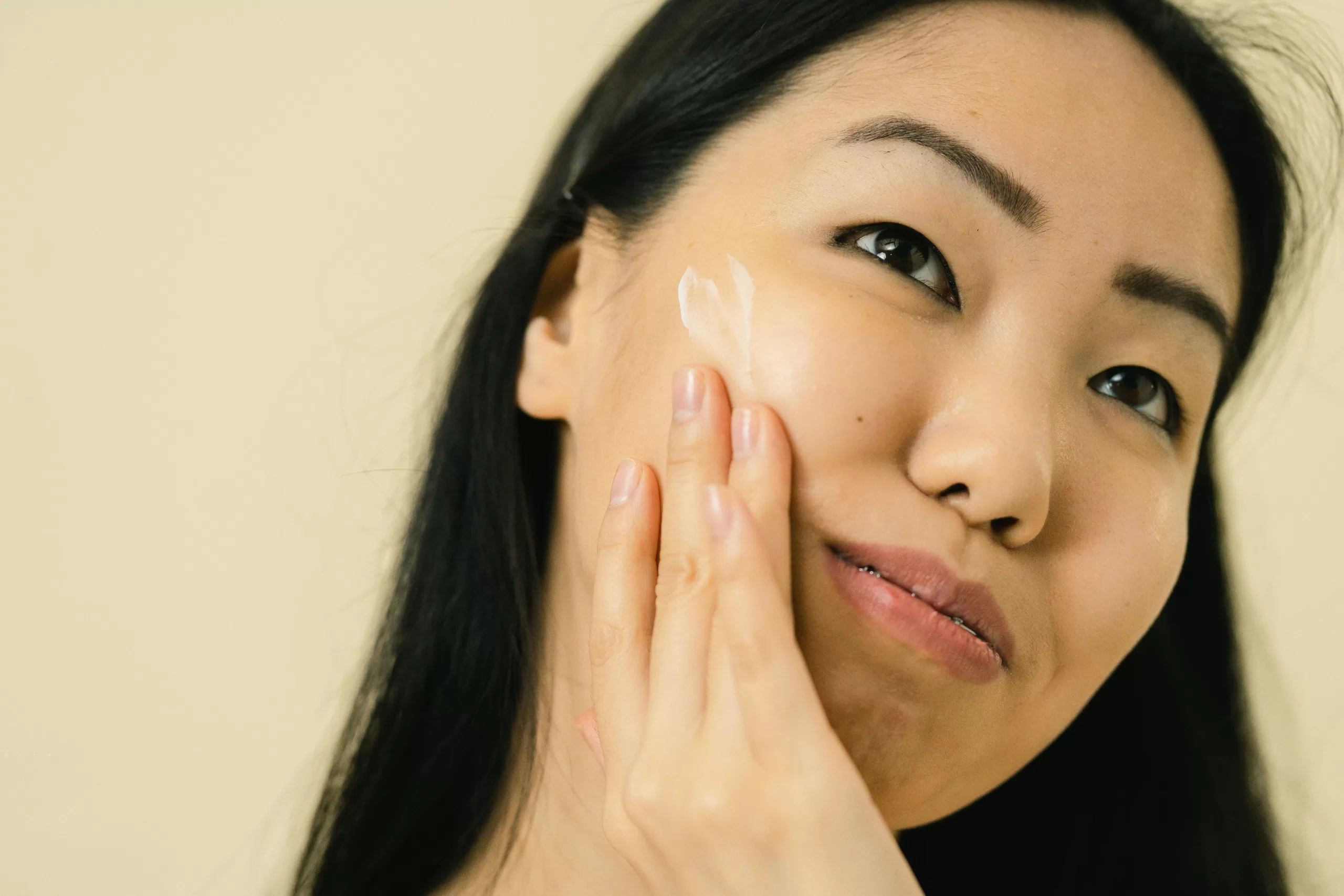 Image of a woman practicing Skincare product combinations